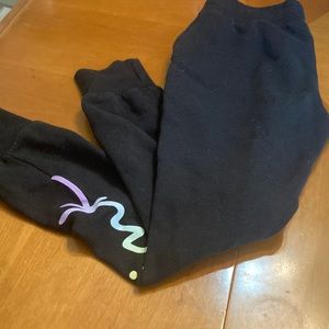 Victoria Secret, black sweatpants with writing.